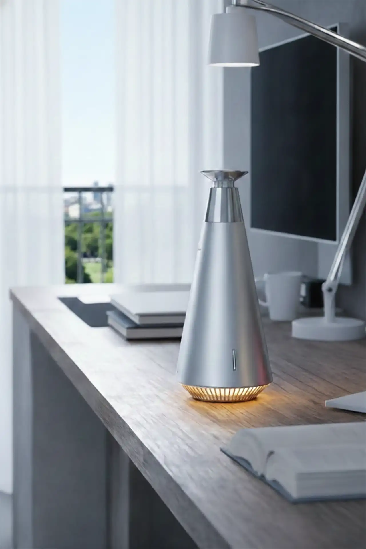 A sculptural aroma diffuser in a calm home workspace